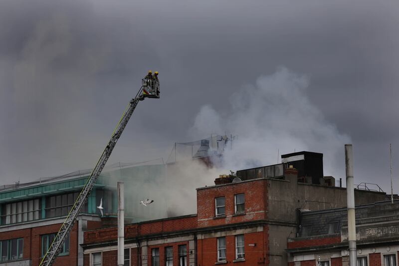Dublin Fire Services attending the fire at a building on Eden Quay in Dublin City centre on Tuesday. Photo: Bryan O’Brien
