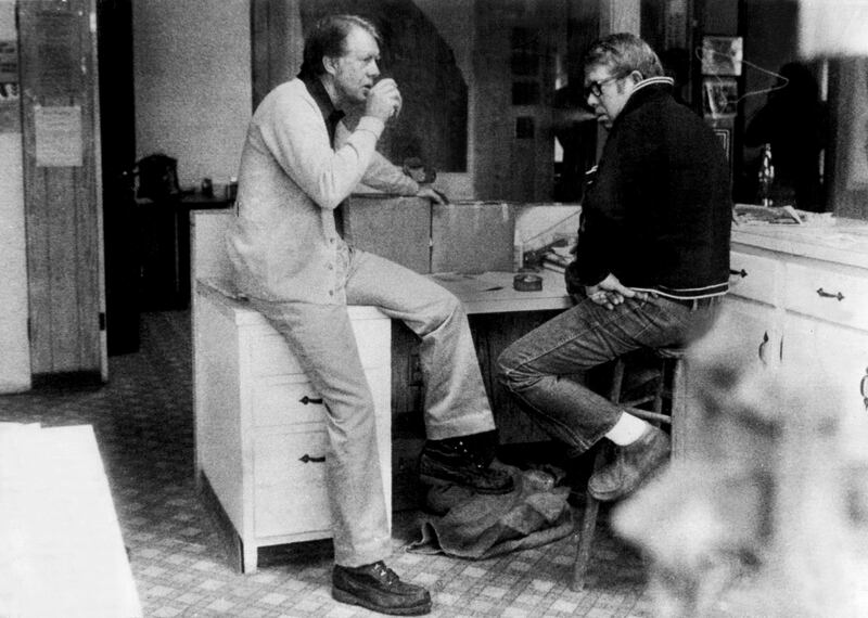 Jimmy Carter has coffee with his brother Billy at a peanut warehouse in Plains  after voting in  the 1976 presidential election. Photograph: George Tames/The New York Times
