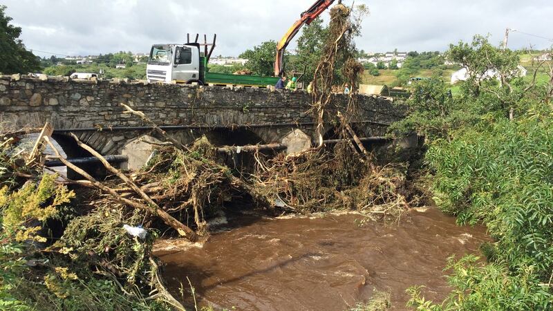 The clean-up  which  got under way at Cockhill Bridge in Buncrana, Co Donegal. Photograph:  Brian Hutton/PA Wire