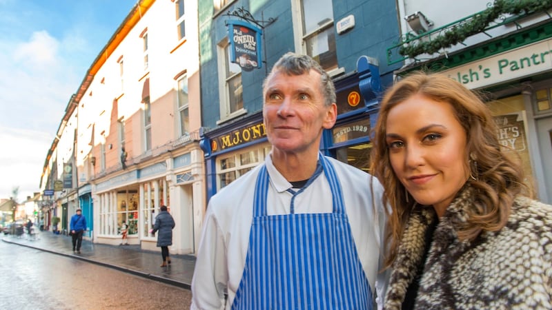 Louise O’Neill pictured with her father Michael outside  his butcher’s shop  in Clonakilty, Co Cork. Photograph: Michael Mac Sweeney/Provision