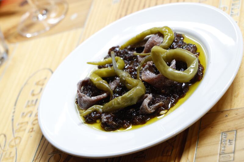 Aubergine caponata with Cantabrian anchovies and gondola peppers at Green Man Wines.  Photograph: Nick Bradshaw 