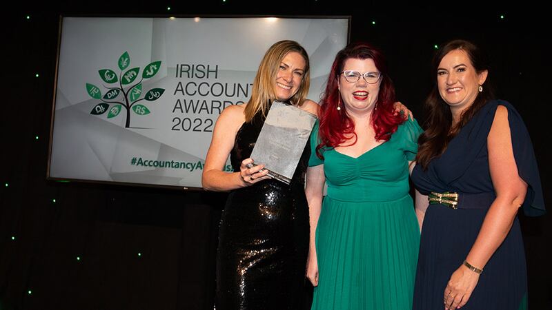 Roisin Nash, customer success manager, Circit, presents the COVID-19 Crisis Response Award to Anna Savage and Emer Brosnan, Fexco.