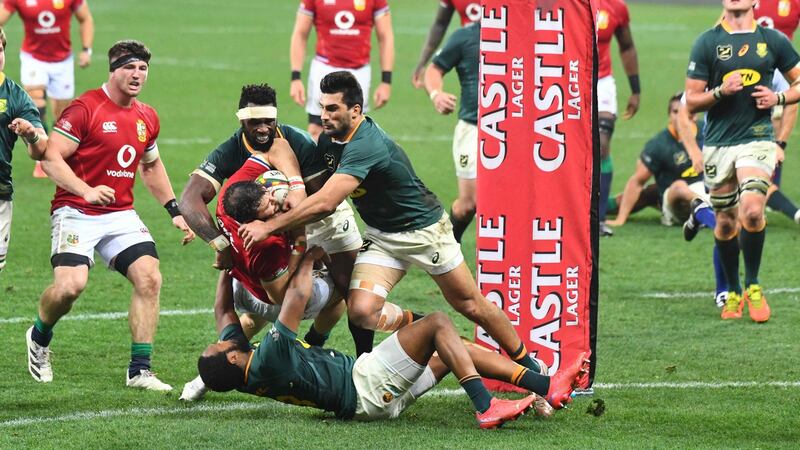 Lions centre Robbie Henshaw is tackled over the South Africa  try line during the second  Test in Cape Town. Photograph:   Rodger Bosch/AFP via Getty Images