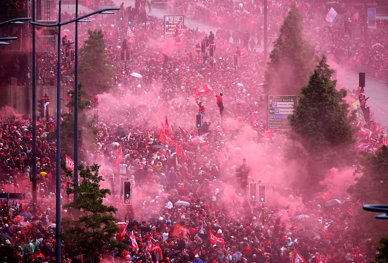 Plenty of red flares seem to have made it into Liverpool's celebrations. Photograph: Owen Humphreys/PA Wire