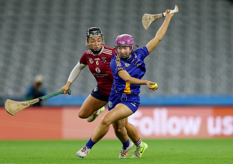 St Finbarr's Orlaith Cahalane is challenged by Athenry’s Dervla Higgins. Photograph: James Crombie/Inpho