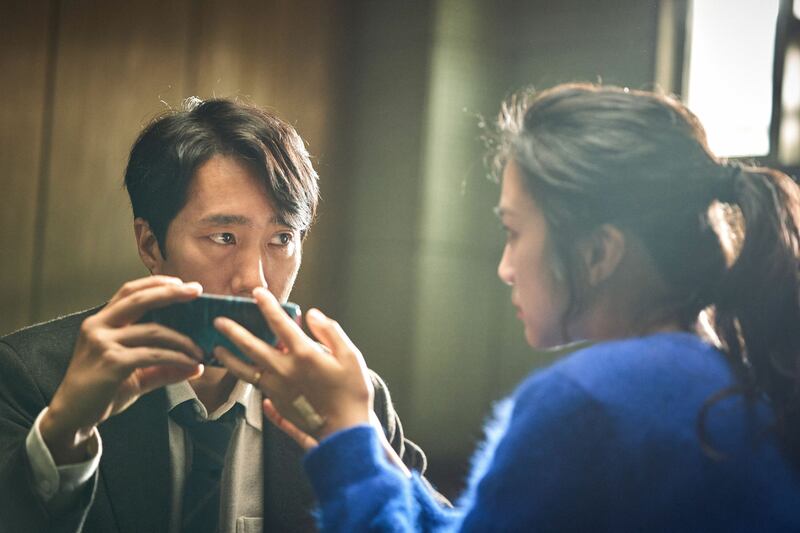 Park Hae-il and Tang Wei in Decision to Leave