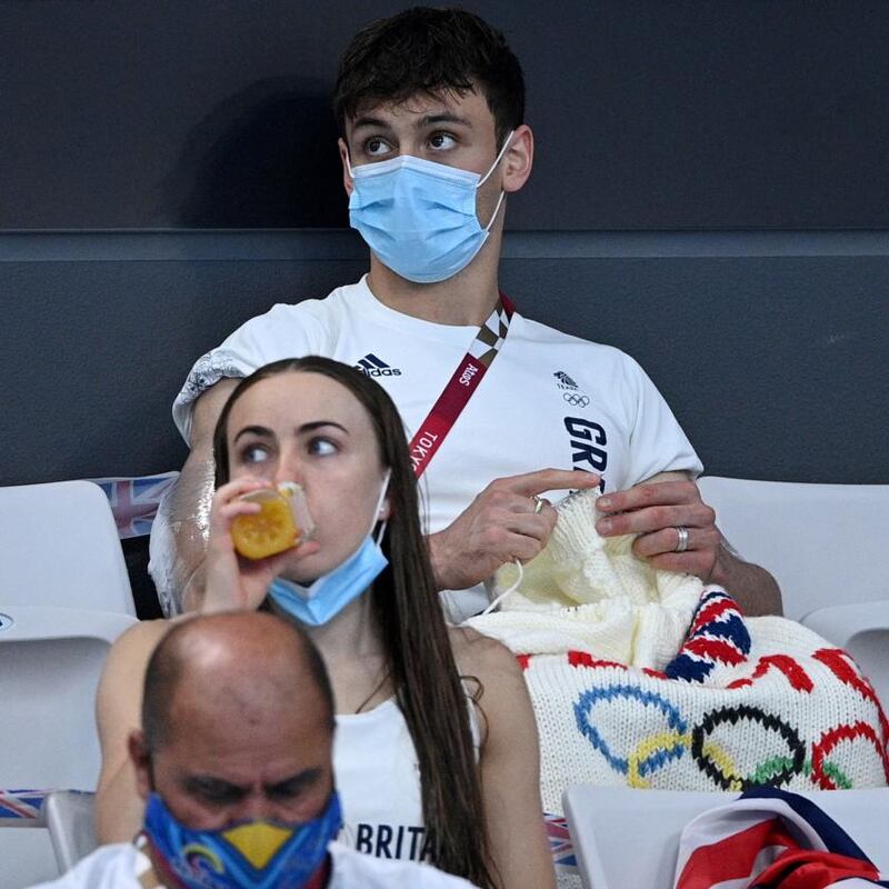 Daley knitting in the stands at the Tokyo Olympics. Photograph:  Oli Scarff/AFP via Getty