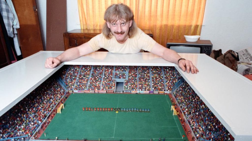 Carl Pownall shows off his impressive Subbuteo set and stadium. Photograph: Getty Images