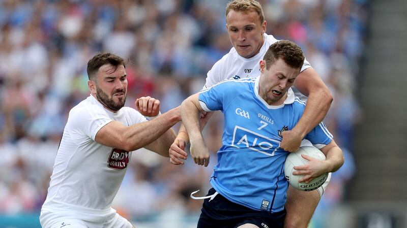 Kildare’s Tommy Moolick tackles Dublin’s Jack McCaffrey during the Leinster SFC Final. Photograph: Photograph: Oisin Keniry/Inpho
