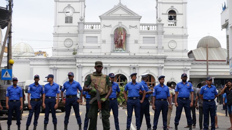 Sri Lankan soldiers secure the area around St Anthony’s Shrine after a blast in Colombo. Photograph: Eranga Jayawardena/AP Photo