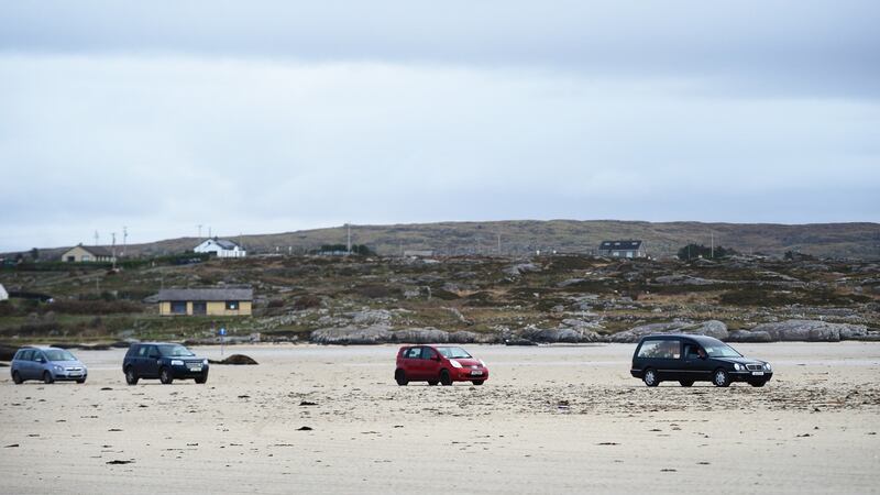 The remains of Pascal Whelan are brought across the sands at low tide to Omey Island in Connemara for burial following funeral mass in nearby Star of the Sea Church in Claddaghduff, Co Galway. Photograph: Bryan O’Brien