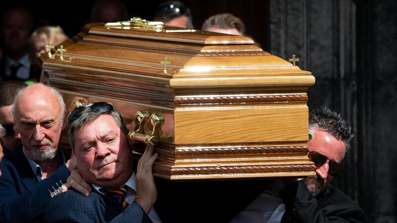 The coffin of comedian Brendan Grace is  carried from St Nicholas of Myra church in Dublin’s Liberties. Photograph: Tom Honan/The Irish Times.