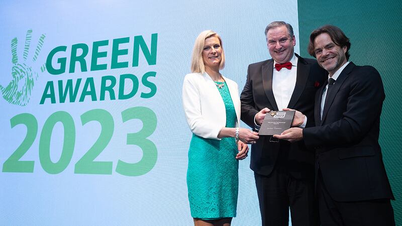 Minister Pippa Hackett and Mark Bennett, awards judge, present the Green Technology Award to Denis Collins, ActionZero.