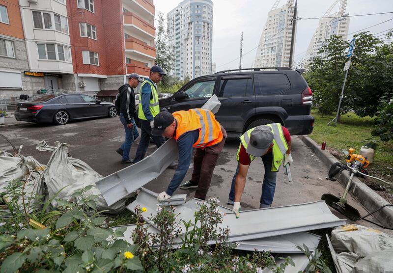 Municipal workers collect debris the morning after two drones were shot down in Krasnogorsk in Russia's Moscow region in  August 2023. Photograph: Yuri Kochetkov/EPA