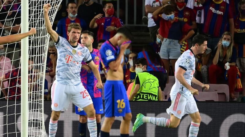 Bayern Munich forward Robert Lewandowski celebrates scoring a goal during the Champions League game against Barcelona at the Nou Camp. Photograph:  Lluis Gene/AFP via Getty Images