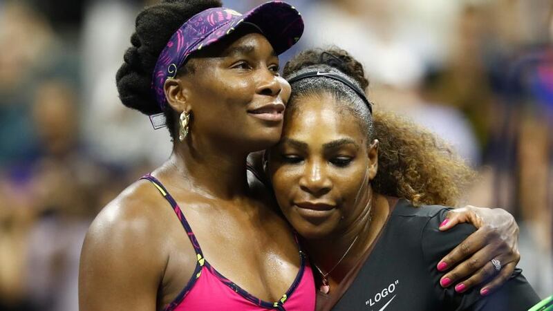 Greatest sister act in the history of the game: Venus Williams congratulates sister Serena after her straight sets win at Flushing Meadows. Photograph: Julian Finney/Getty