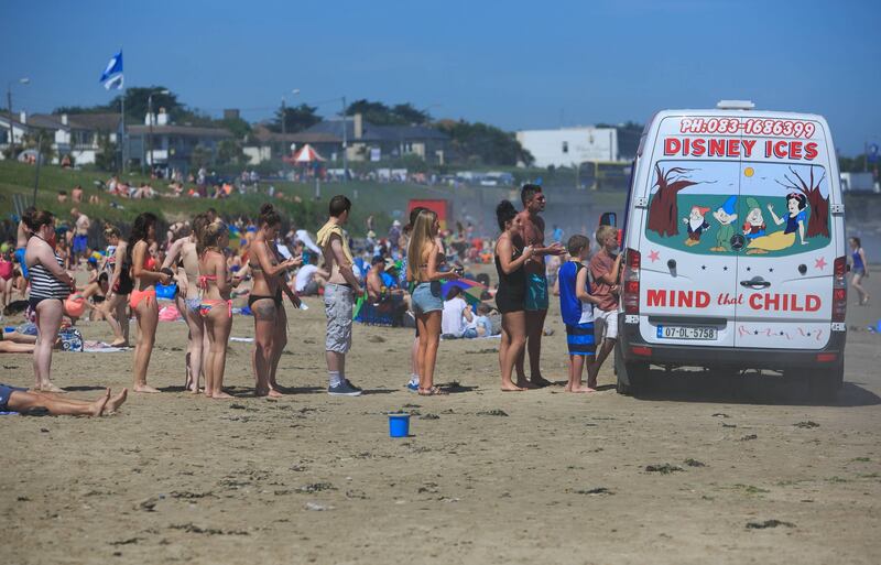 People enjoying good weather on Portmarnock Beach, Dublin. Photograph: Gareth Chaney/Collins