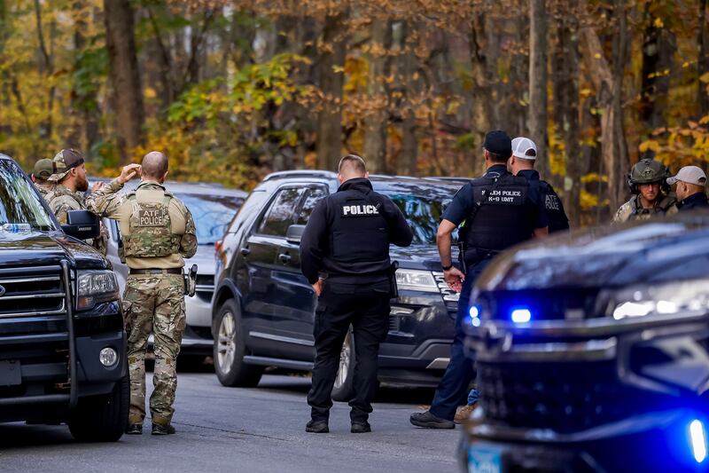 Law enforcement gather near the home of mass-shooting suspect Robert Card in Bowdoin, Maine, USA, on Thursday. Photograph: EPA 