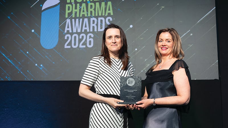 Emma Lynch, awards judge, presents the best sales & commercial leadership award to Lisa Mullaney, Medguard Healthcare