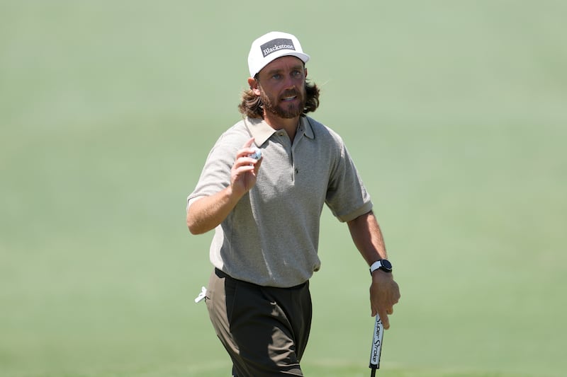 Tommy Fleetwood of England acknowledges the crowd on the second hole. Photograph: Andrew Redington/Getty