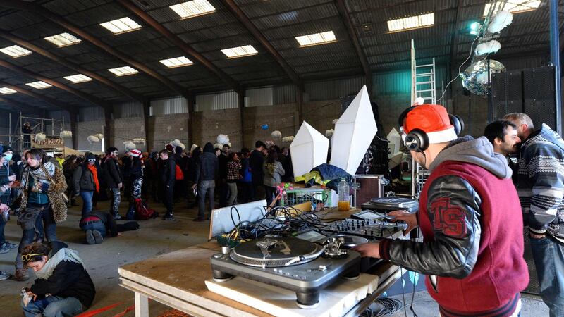 A DJ plays music during a party in Lieuron. Photograph: Jean-Francois Monier/AFP/Getty