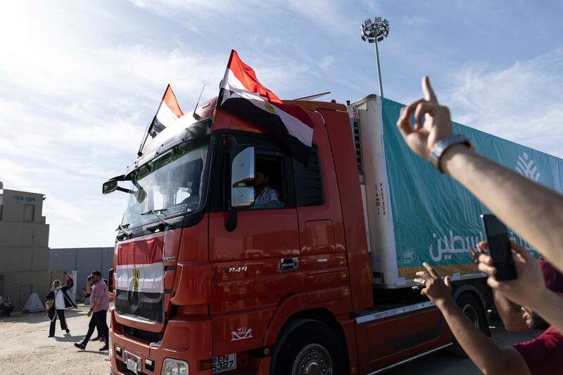 Aid convoy trucks cross the Rafah border into Gaza from the Egyptian side on Saturday. The aid convoy was organised by a group of Egyptian NGOs. Photograph: Mahmoud Khaled/Getty Images