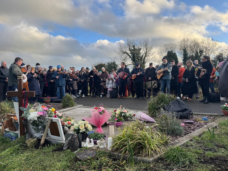 Music was played as hundreds gathered at the shrine to murdered schoolteacher Ashling Murphy along the Grand Canal in Tullamore, Co Offaly, on Monday. Photograph: Bairbre Holmes/PA Wire 