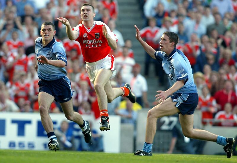 Oisín McConville scores the winning point for Armagh in the 2002 All-Ireland football semi-final against Dublin. Photograph: Tom Honan/Inpho
