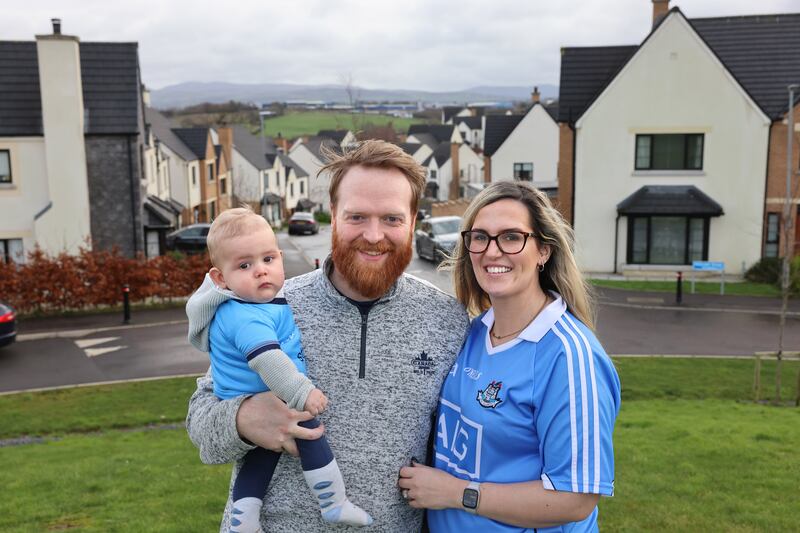 Emma Morgan, originally from Skerries, Co Dublin, pictured with her husband Joe and seven-month-old son James, in Hillcrest estate, Newry. Photograph: Dara Mac Dónaill








