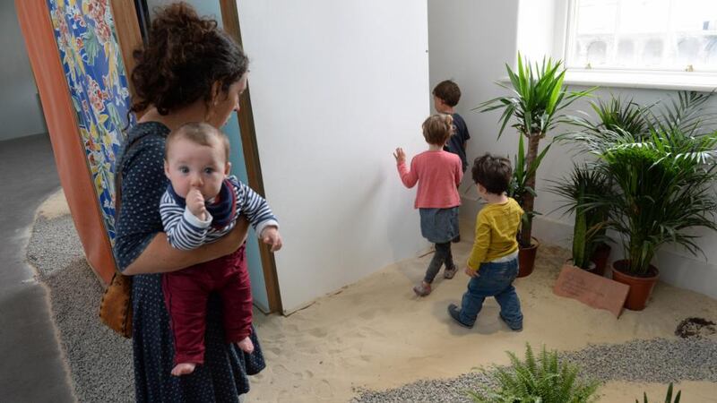 Artistic touch: Sara Keating at Imma with her seventh-month-old baby and two-year-old son. Photograph: Frank Miller