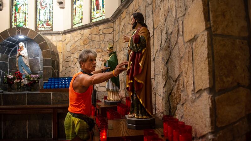 Tom McGrath, owner of the Black Sheep pub, in the Church of the Immaculate Conception, a regular stop on his running route in New York. Photograph: Monique Jaques/The New York Times
