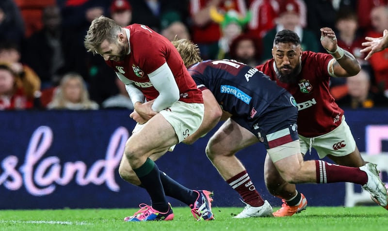 Lions' Elliot Daly reacts after fracturing his arm in a tackle against Queensland Reds on Wednesday. Photograph: Billy Stickland/Inpho