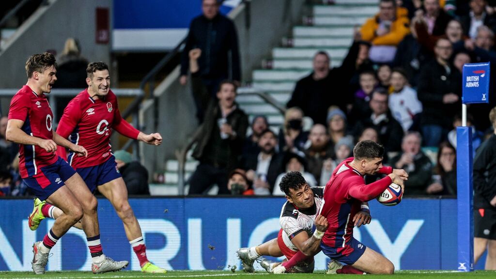 England’s George Furbank and Jonny May celebrate as Ben Youngs scores a try against Tonga. Photo: Laszlo Geczo/Inpho