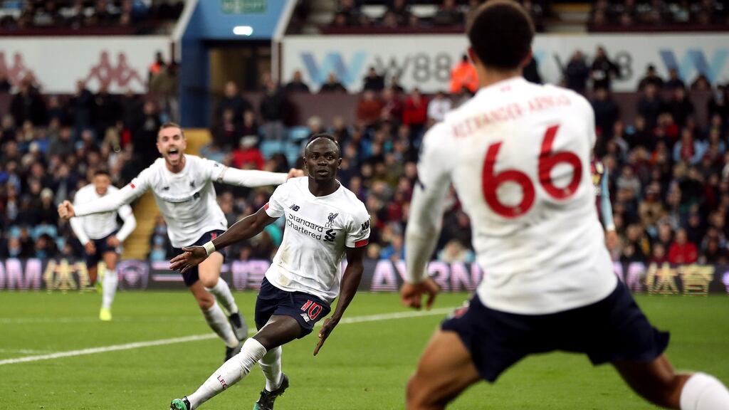 Liverpool’s Sadio Mane celebrates his injury time winner at Villa Park. Photograph: PA