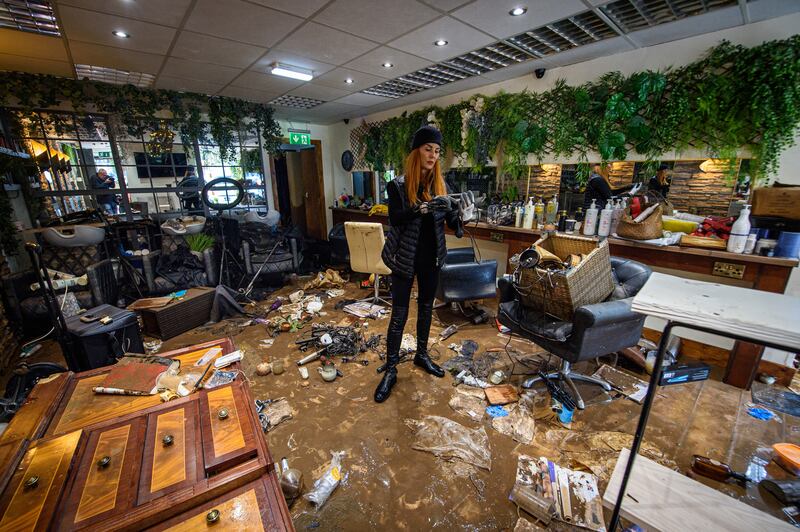 Rosaleen O’Donnell surveys her destroyed hair salon in Midleton, Co Cork, after flooding caused by Storm Babet. Photograph: Dan Linehan