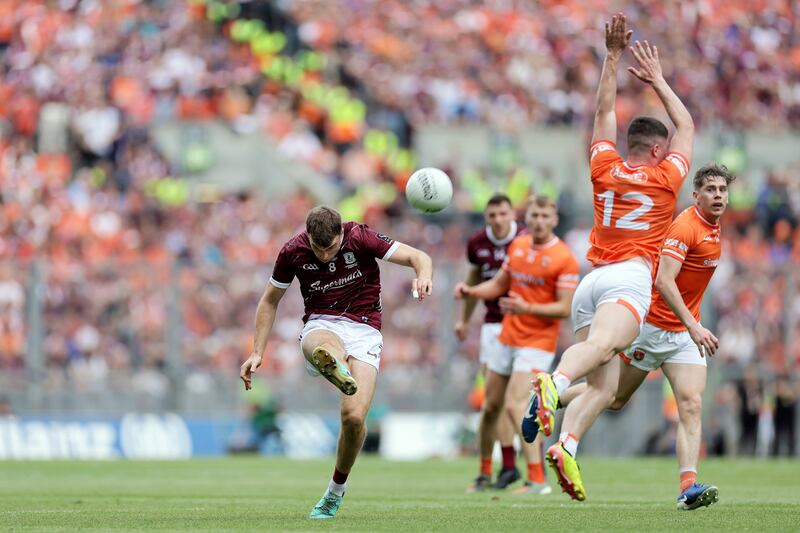 Galway's Paul Conroy gets a shot away under pressure from Armagh's  Oisín Conaty. Photograph: Laszlo Geczo/Inpho