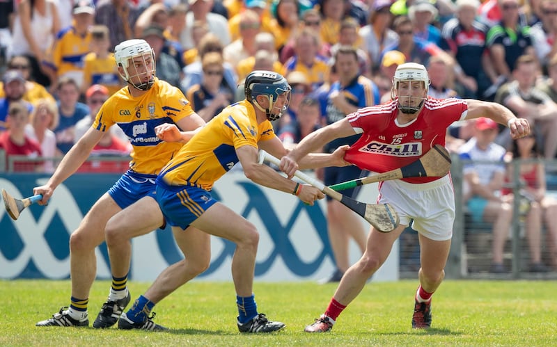 Patrick Horgan in tackled by Clare's David McInerney during the 2018 Munster final in Thurles. Photograph: Morgan Treacy/Inpho