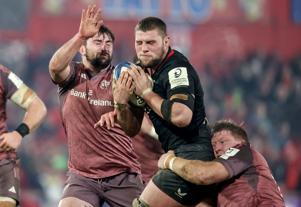 Munster’s Diarmuid Barron and Stephen Archer tackle Tom Willis of Saracens. Photograph: Dan Sheridan/Inpho