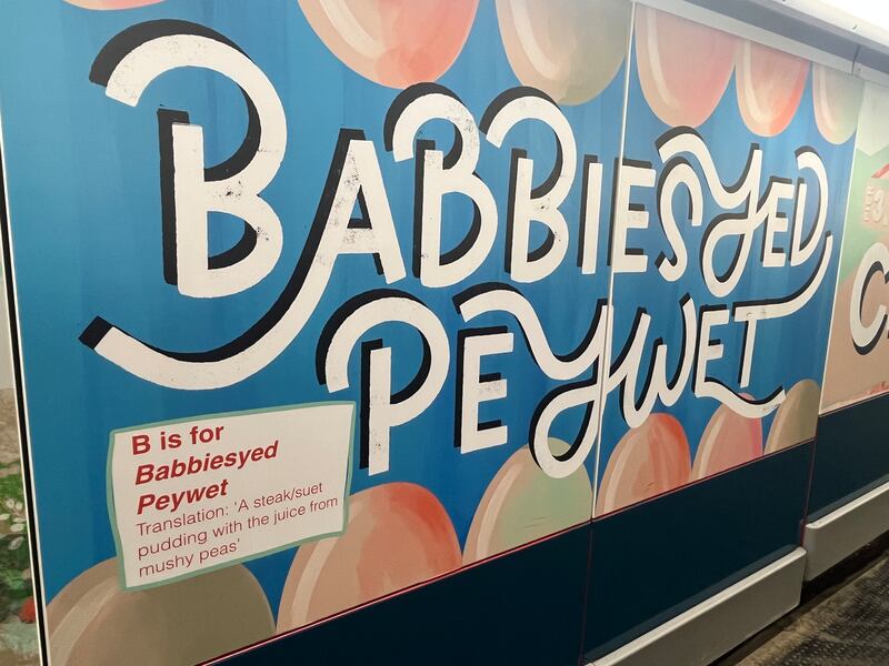 A mural of a favourite dish of the local area, a Babby's Yed with pey wet (a baby's head steamed pudding with pea juice). Photograph: Mark Paul