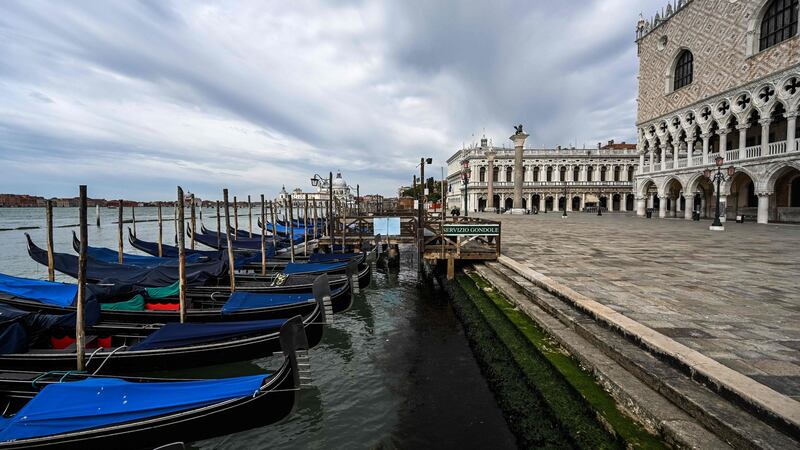 Gondolas moored at the Riva degli Schiavoni embankment by the Doge’s Palace in Venice on May 13th.  Photograph: Vincenzo Pinto/AFP via Getty Images