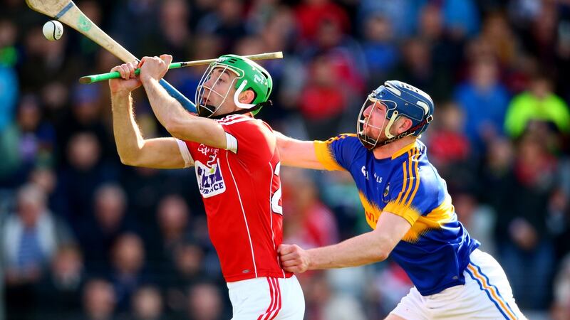 Cork’s Michael Cahalane is challenged by Tipp’s Thomas Hamill. Photograph: Cathal Noonan/Inpho