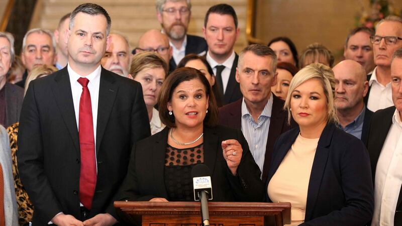 Sinn Fein party leader Mary Lou McDonald (C) speaks flanked by deputy leader Michelle O’Neill (R) and other colleagues at the Parliament Buildings on the Stormont Estate. Photograph: Paul Faith/AFP via Getty Images