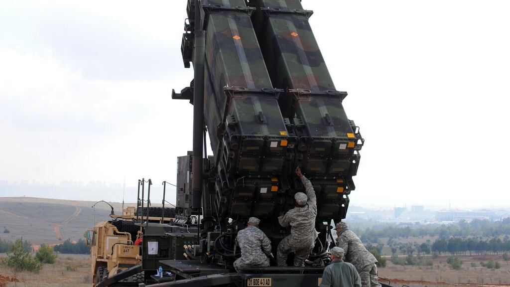 In this file photo taken on February 2013, US soldiers work on a Patriot missile system at a Turkish military base in Gaziantep. Photograph: Bulent Kilic/AFP