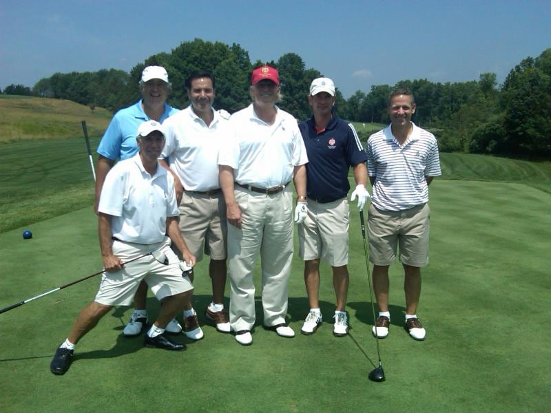 Edward Walsh, second right in navy T-shirt, poses with Donald Trump, centre, at Trump National Golf Club in Bedminster, New Jersey. Photograph: Lamington Golf