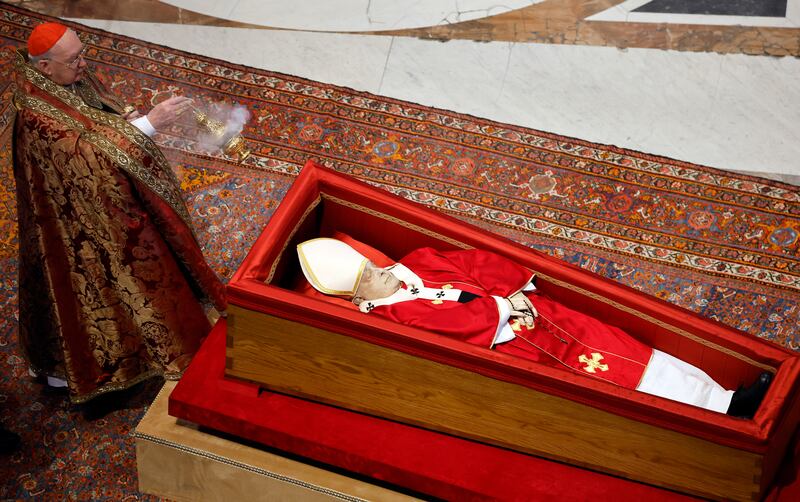Cardinal Kevin Farrell holds incense next to Pope Francis' coffin at the basilica at St Peter’s Square. Photograph: Mario Tama/Getty Images