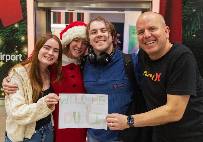 Ronan McLaughlin is welcomed home from New York by his family - Grace, Gillian and Paul from Cabinteely, Co Dublin. Photograph: Colin Keegan/Collins, Dublin