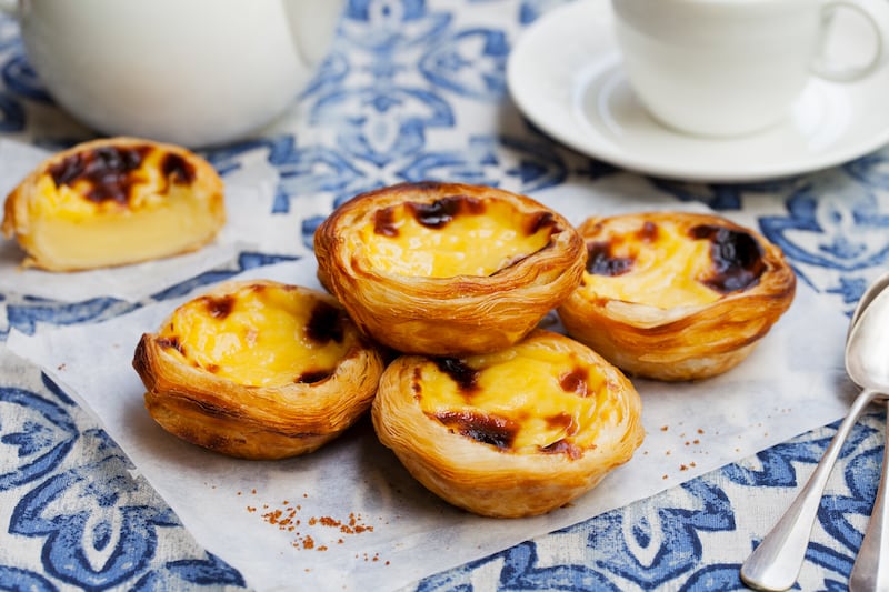 Enjoy a traditional pastel de nata, Portugal’s beloved custard tart
