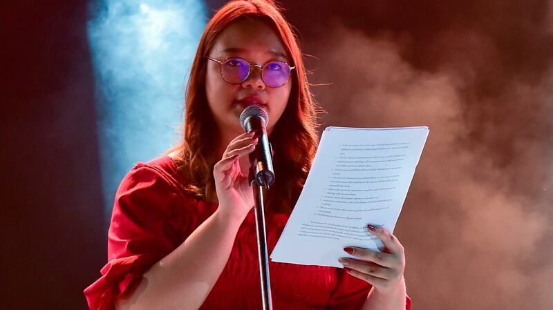 Student spokeswoman Panusaya Sithijirawattanakul reads a list of demands including the abolition of the kingdom’s draconian royal defamation law during a pro-democracy rally at Thammasat University. Photograph:  Lillian Suwanrumpha/AFP via Getty