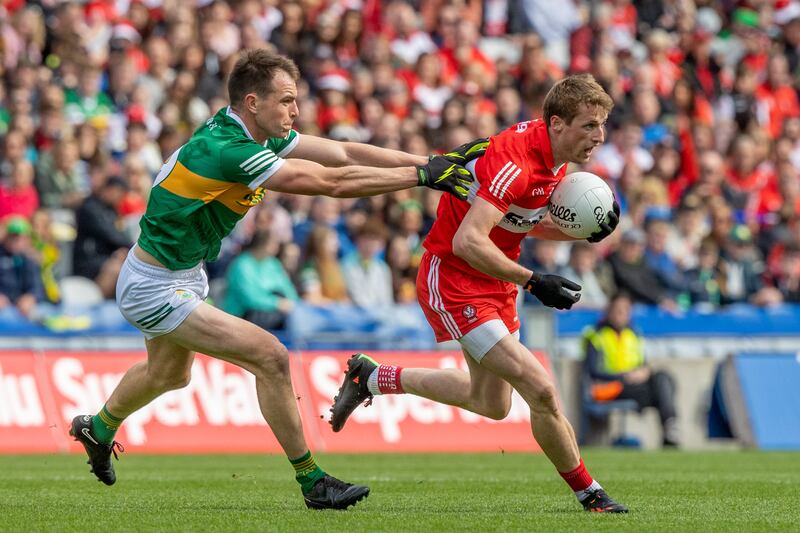 Jack Barry with Brendan Rogers of Derry. Barry has a good record against Dublin's Brian Fenton. Photograph: Morgan Treacy/Inpho
