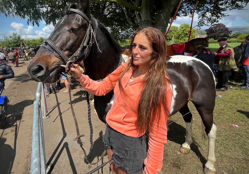 Lucy Smith, a young Traveller from Morecambe, with her horse Comanche at the Flashing Lane at the Appleby Horse Fair. Photograph: Mark Paul